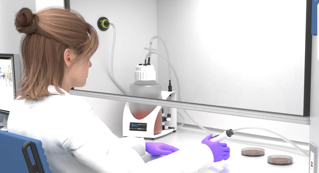 Scientist working with a BVC fluid aspiration system