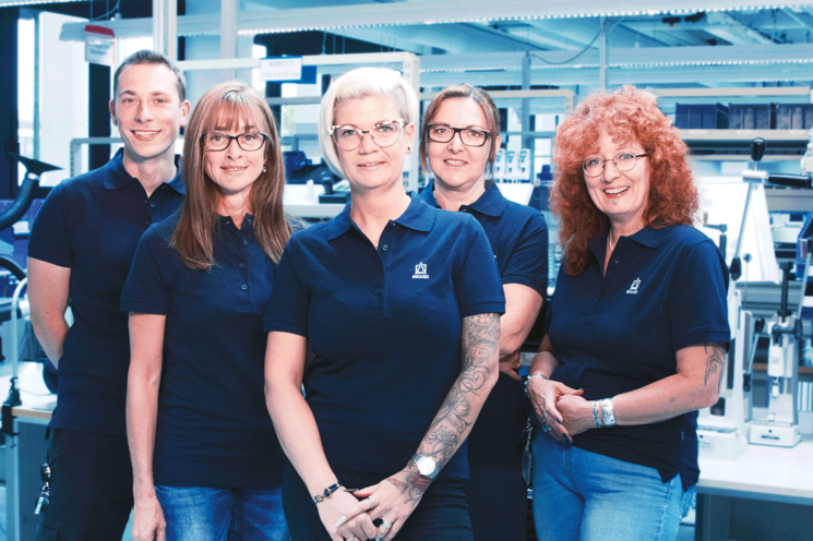 Employees looking into the camera