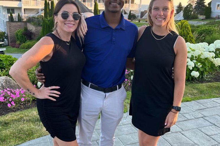 Three employees looking into the camera