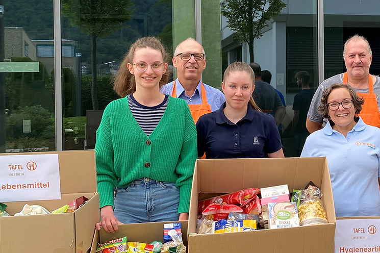 Group of employees standing in front of the camera