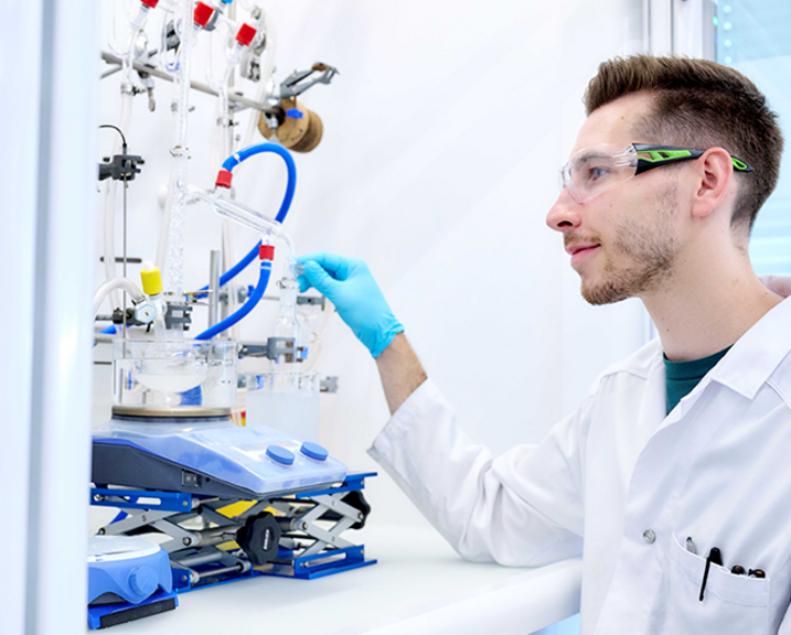 Scientist working on a Schlenk line in a laboratory