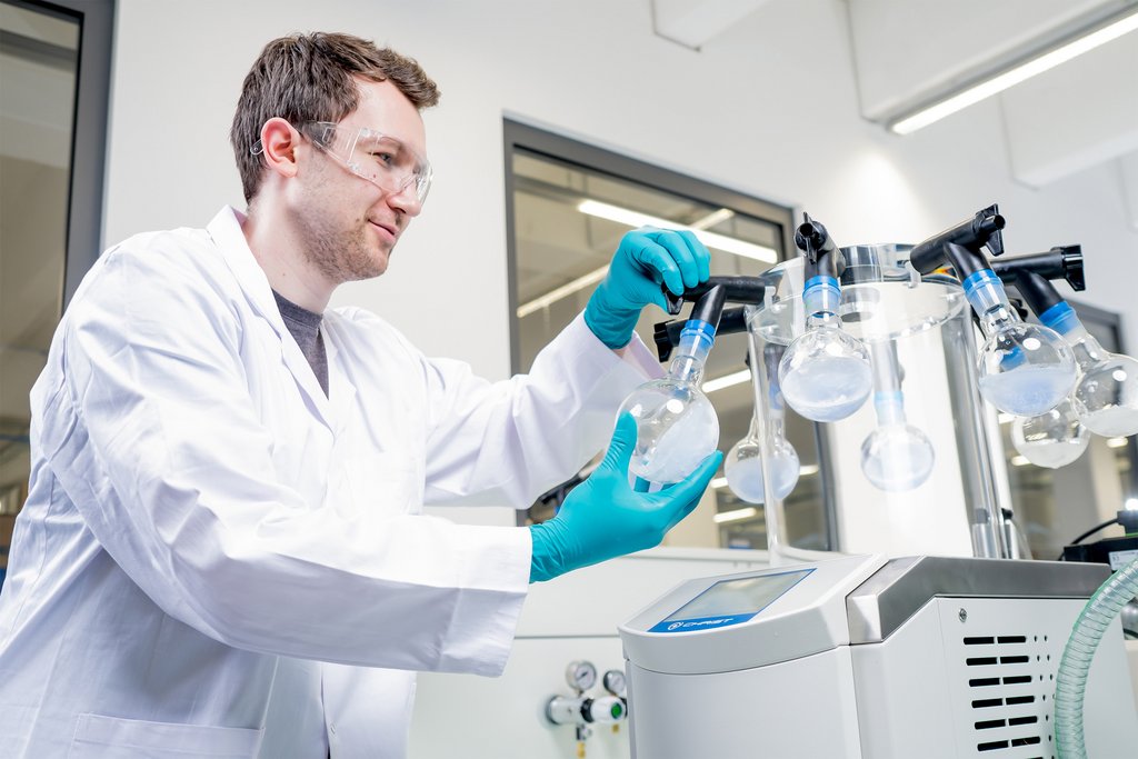 Scientist preparing the freeze dryer for lyophilization